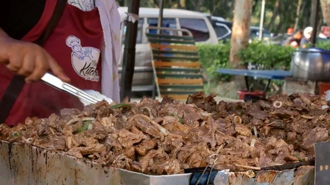 Roasted lamb selling at the Ramadan bazaar, Malaysia. 動画素材 108992471