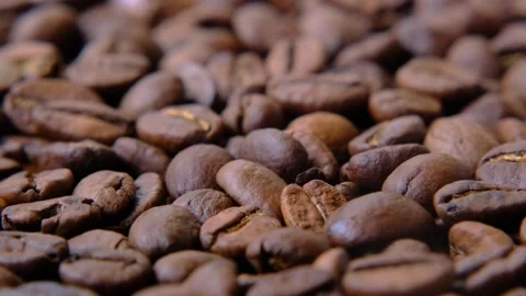 Roasted local coffee beans on rotating platform Stock Footage 243848379