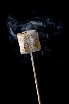 Roasted Marshmallow on a black background Stock Photos