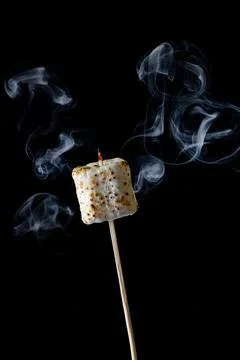 Roasted Marshmallow on a black background Stock Photos