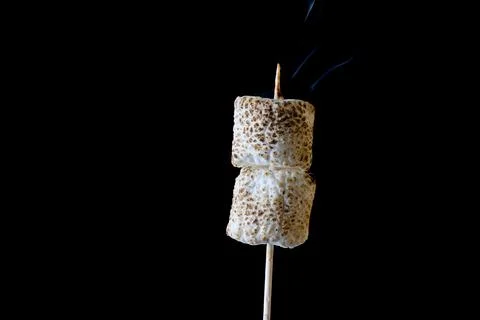Roasted Marshmallow on a black background Stock Photos