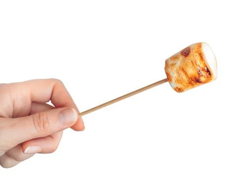 Roasted marshmallows on a skewer on white background Foto stock