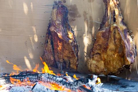 Roasted meat on crosses. Stock Photos