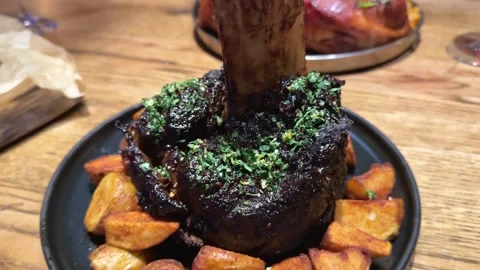 Roasted meat dish pork knuckle juicy pork knuckles paired with scrumptious eggs Video stock 322661390