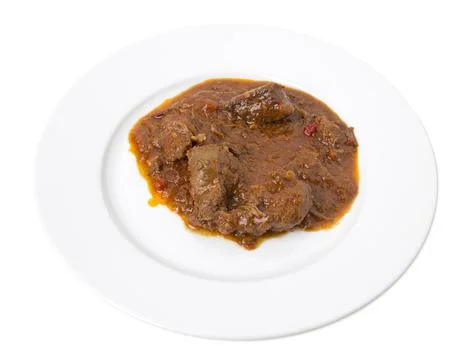 Roasted meat with gravy. Stock Photos