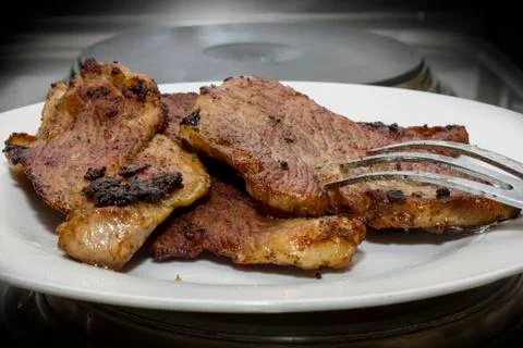 Roasted meat with meat fork Stockfoto's