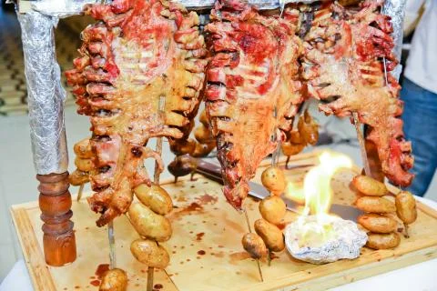 Roasted meat over an open fire, cooked in a special way.Barbecue is prepared Stock Photos