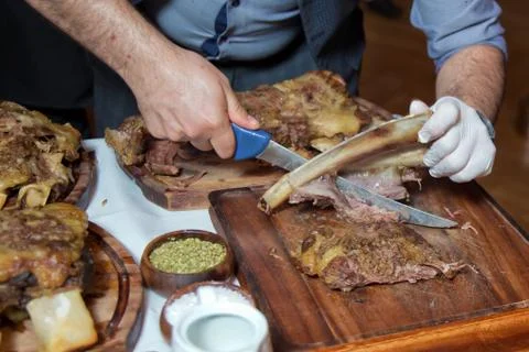 Roasted meat over an open fire, cooked in a special way.Barbecue is prepared of Stock Photos