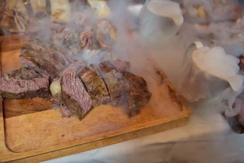 Roasted meat over an open fire, cooked in a special way.Barbecue is prepared  Stock Photos