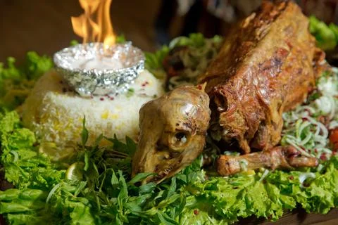 Roasted meat over an open fire, cooked in a special way.Barbecue is prepared of Stock Photos