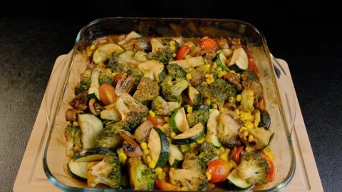 Roasted Mixed Vegetables in Baking Dish on Wooden Board Cooking Stock Footage 341446081