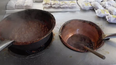 Roasted nuts being stirred Stock Footage 62417344