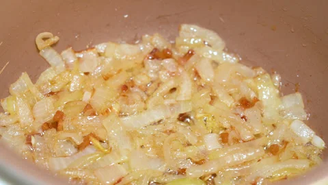 Roasted onions in the pan Stock Footage 247831900