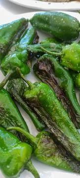 Roasted padron peppers Stock Photos