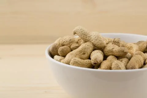 Roasted  peanuts in bowl Stock Photos