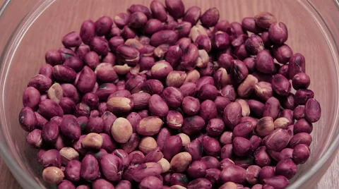 Roasted peanuts in bowl plate Stock Footage 61741573
