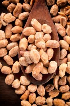 Roasted peanuts in ladle Stock Photos