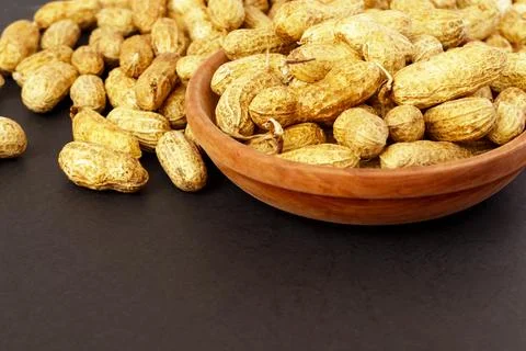 Roasted peanuts, peanuts in shell Isolated on black background Stock Photos