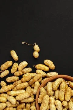 Roasted peanuts, peanuts in shell Isolated on black background Stock Photos