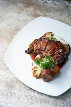 Roasted Pheasant with Cauliflower and Parsnip Puree Stock Photos
