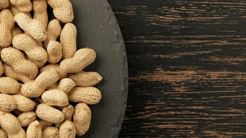 Roasted pile of peanuts in shell rotating. Organic and vegan, vegetarian food. Video stock 226782293