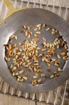 Roasted pine nuts in a pan Stock Photos