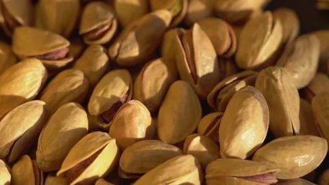 Roasted pistachios close-up. Falling. Pistachio nut with salt. macro Stock Footage 120902349