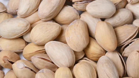 Roasted pistachios with salt rotating close-up Stock Footage 104854604