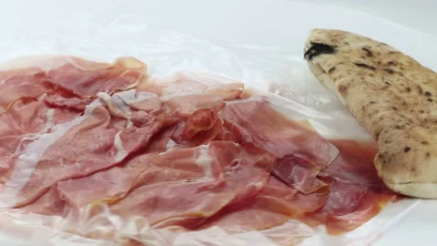Roasted pizza bread with slices of raw ham Stock Footage 142635788
