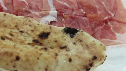 Roasted pizza bread with slices of raw ham Stock Footage 142635806