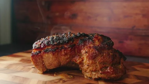 Roasted Pork Joint Steaming on Board Stock Footage 325682976