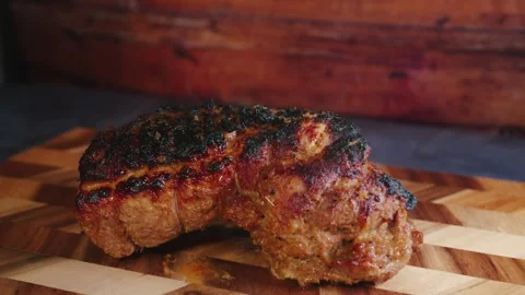 Roasted Pork Joint Steaming on Board Stock Footage 325682977
