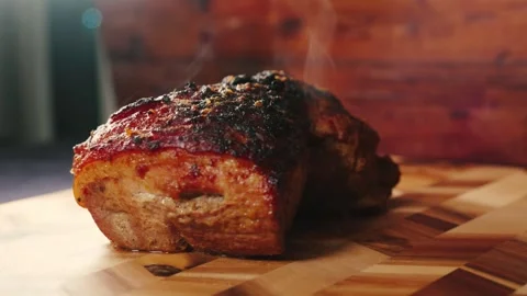Roasted Pork Joint Steaming on Board Stock Footage 325682982