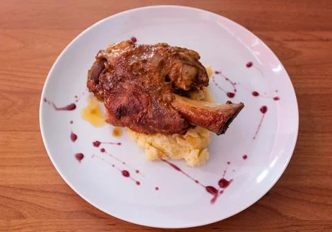 Roasted pork knuckle with mashed potatoes and sauce Stock Photos