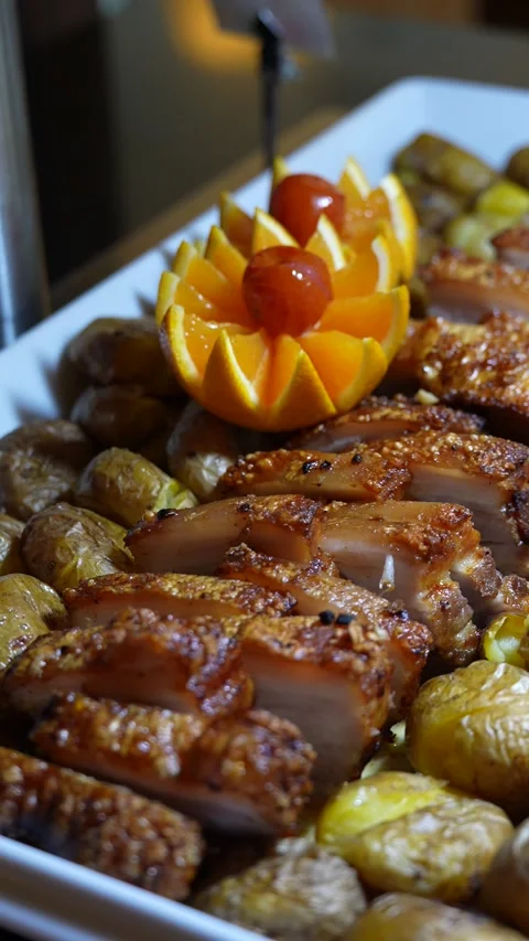 Roasted Pork with Smashed Potatoes at Hotel Buffet Restaurant Stock Footage 342266725