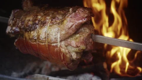 Roasted pork on the spit Stock Footage 185941488