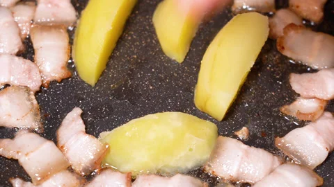 Roasted potatoes and meat cooked in frying pan with vegetable oil Stock Footage 251540908