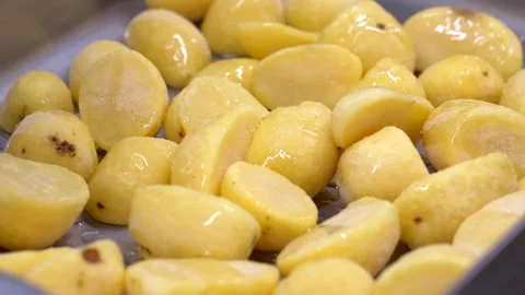 Roasted Potatoes Being Prepared on Baking Tray Stock Footage 321367264