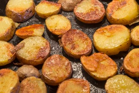 Roasted potatoes in a pan Stock Photos