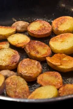 Roasted potatoes in a pan Stock Photos