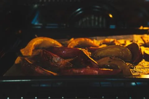 Roasted pumpkin into the oven Stock Photos