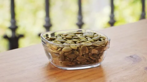 Roasted Pumpkin Seeds are a delicious, crunchy snack with hierro. Stock Footage 286359664