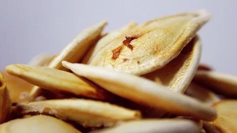 Roasted pumpkin seeds in closeup, looping 360 macro video Stock-Footage 125679620