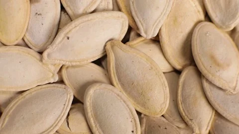 Roasted pumpkin seeds. Macro, selective focus Stock Footage 228922512