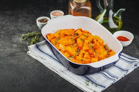 Roasted pumpkin slices with thyme Stock Photos