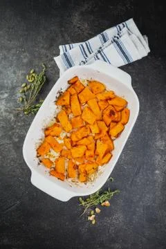 Roasted pumpkin slices with thyme Stock Photos