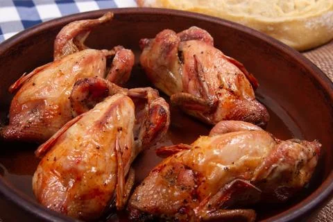 Roasted quail. Close-up. Stock Photos