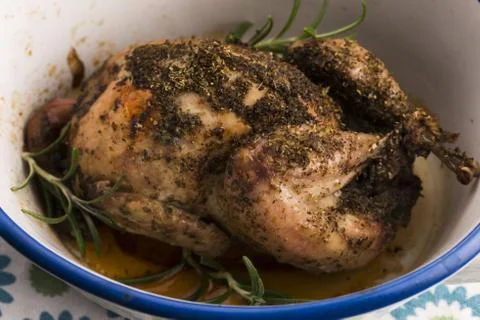 Roasted quail with herbs Stock Photos