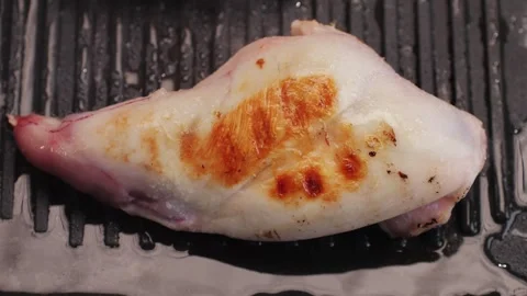 Roasted rabbit legs in a grill pan, healthy diet meat close up, chef cooking Stock Footage 267507073