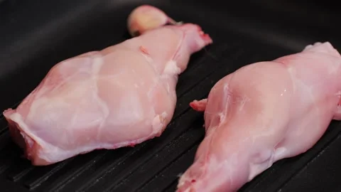 Roasted rabbit legs in a grill pan, healthy diet meat close up, chef cooking Stock Footage 270483360
